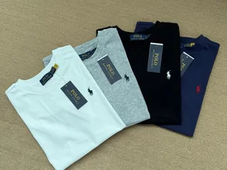 Folded T-shirts in white, mint, gray and navy
