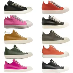 Ten canvas low-tops with thick white soles in black, red, pink, mustard and green