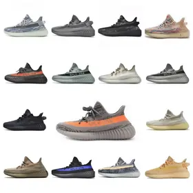 Grid of sixteen knit running shoes, mostly grey and brown with one orange stripe