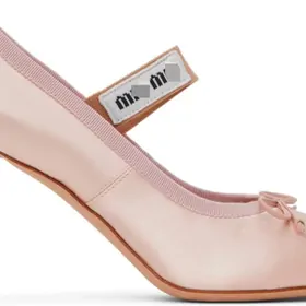 Close view of a pale pink satin Mary Jane shoe with a slim heel