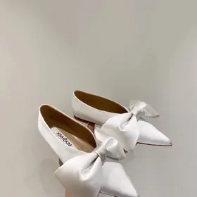 White satin pointed flats with large bows