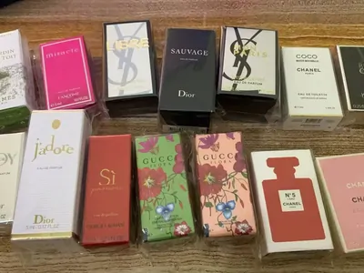 Boxed perfume bottles lined up on a table